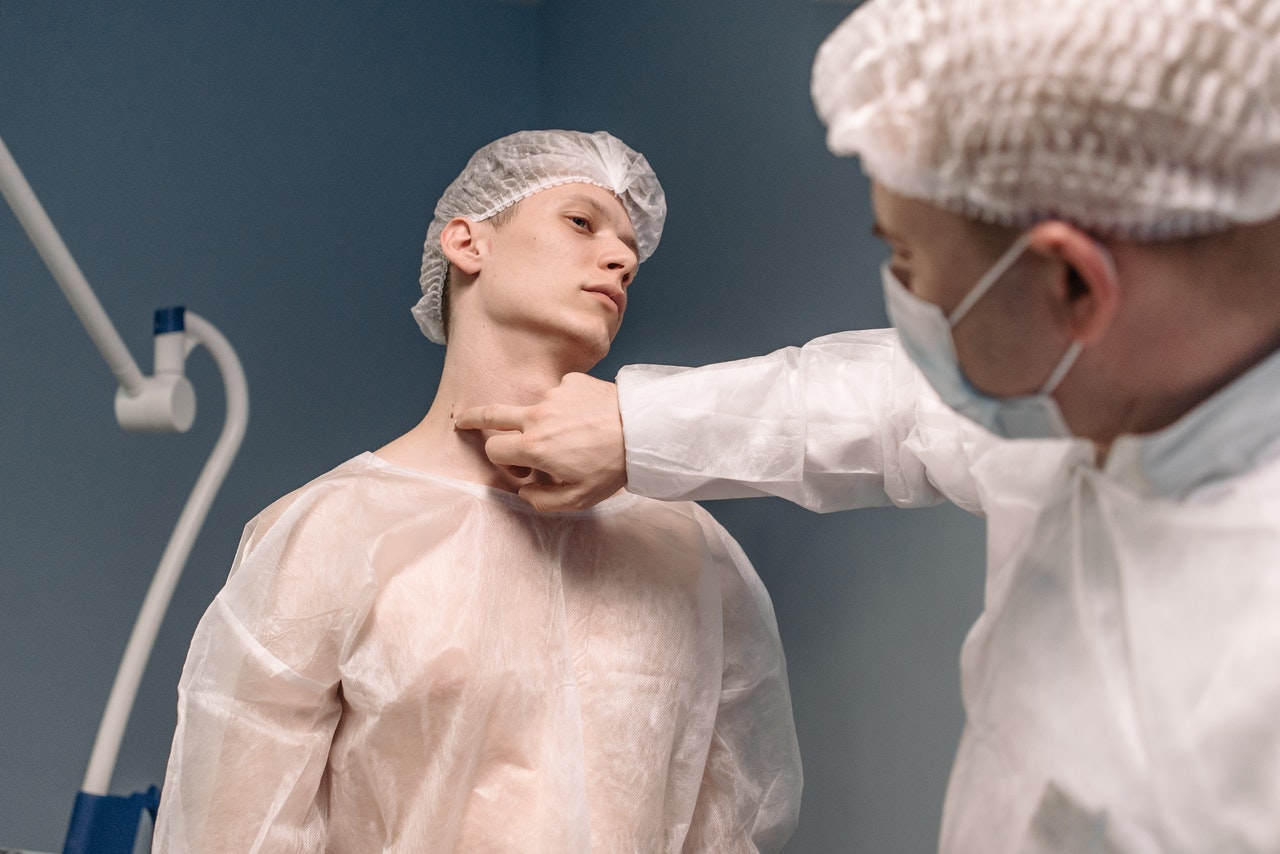 Big mole on mans neck ready to be removed