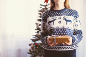 Young woman wears christams sweater