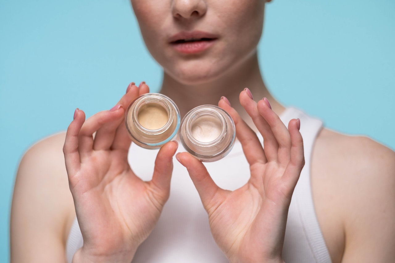 Concealer product in woman hands